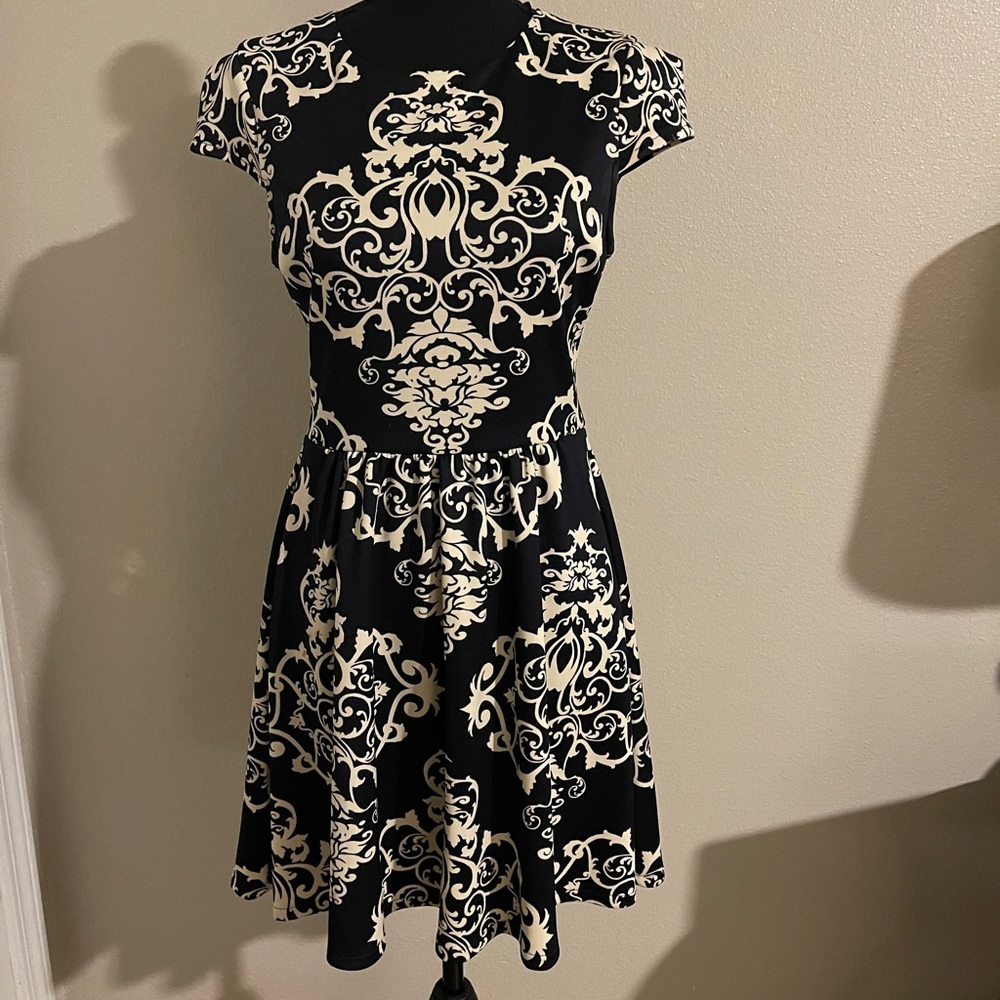 A woman’s navy blue asymmetrical dress